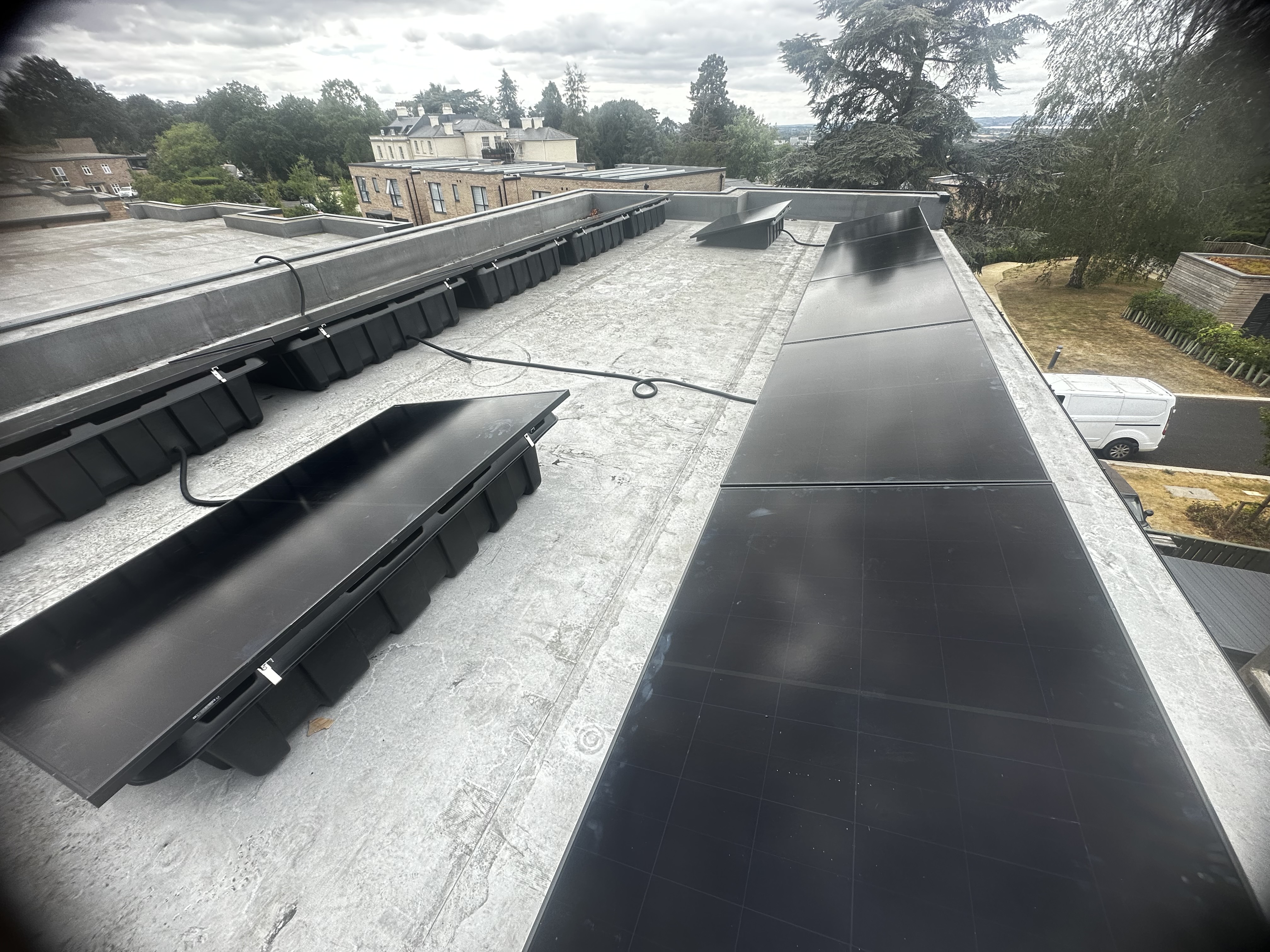 Solar panels installed on a large flat roof